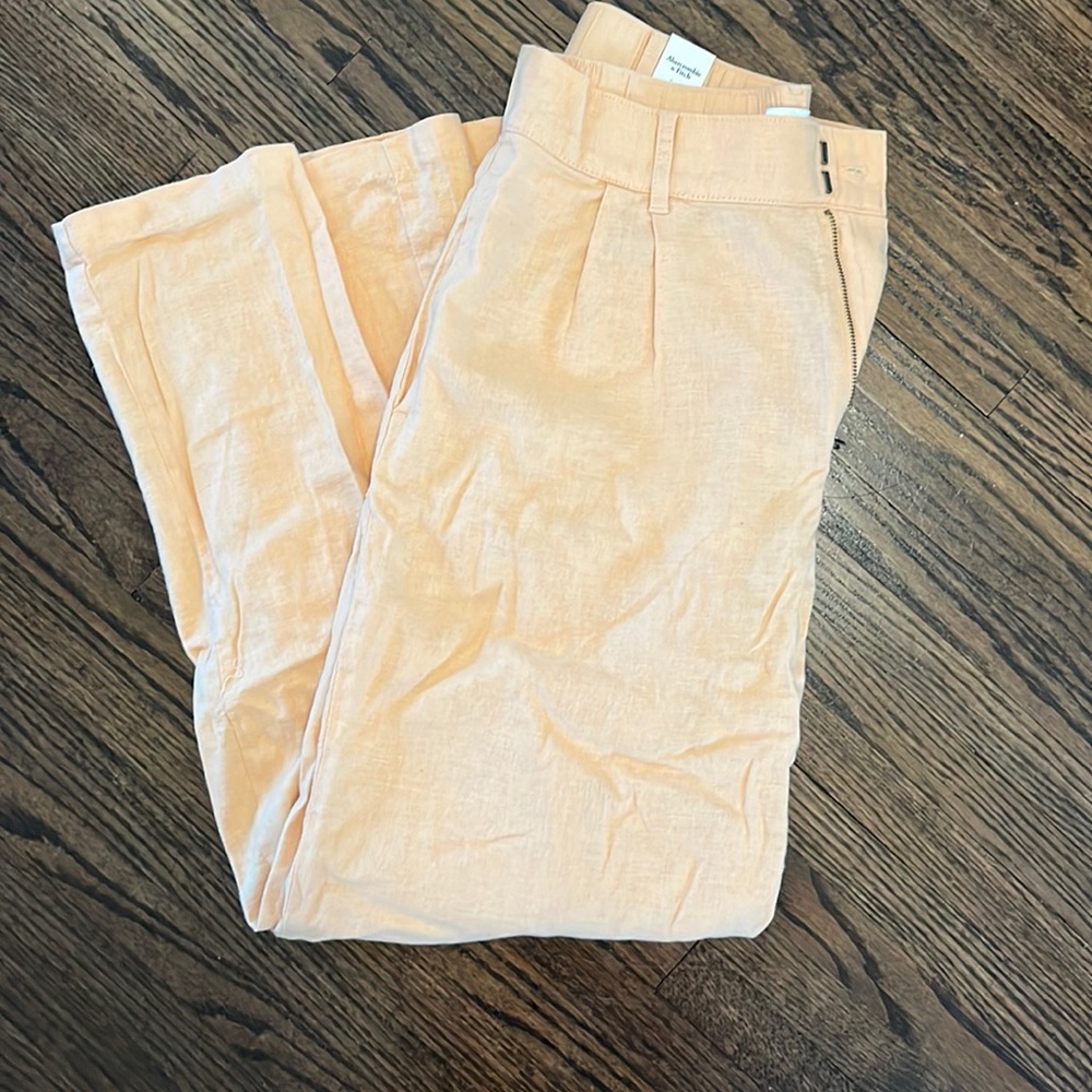 Never worn, orange trousers!